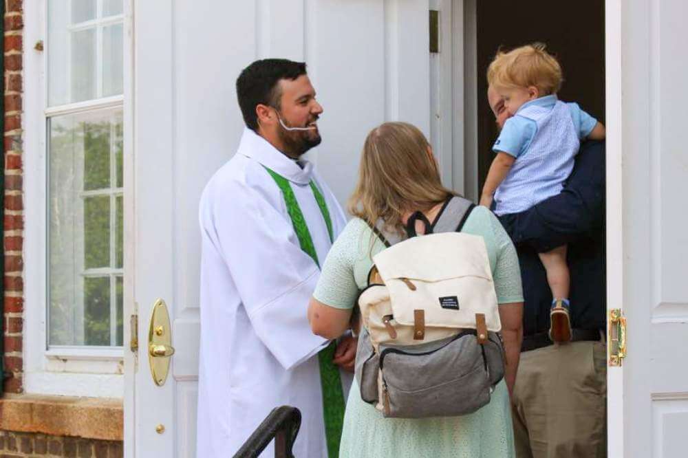 pastor-greeting-family_post